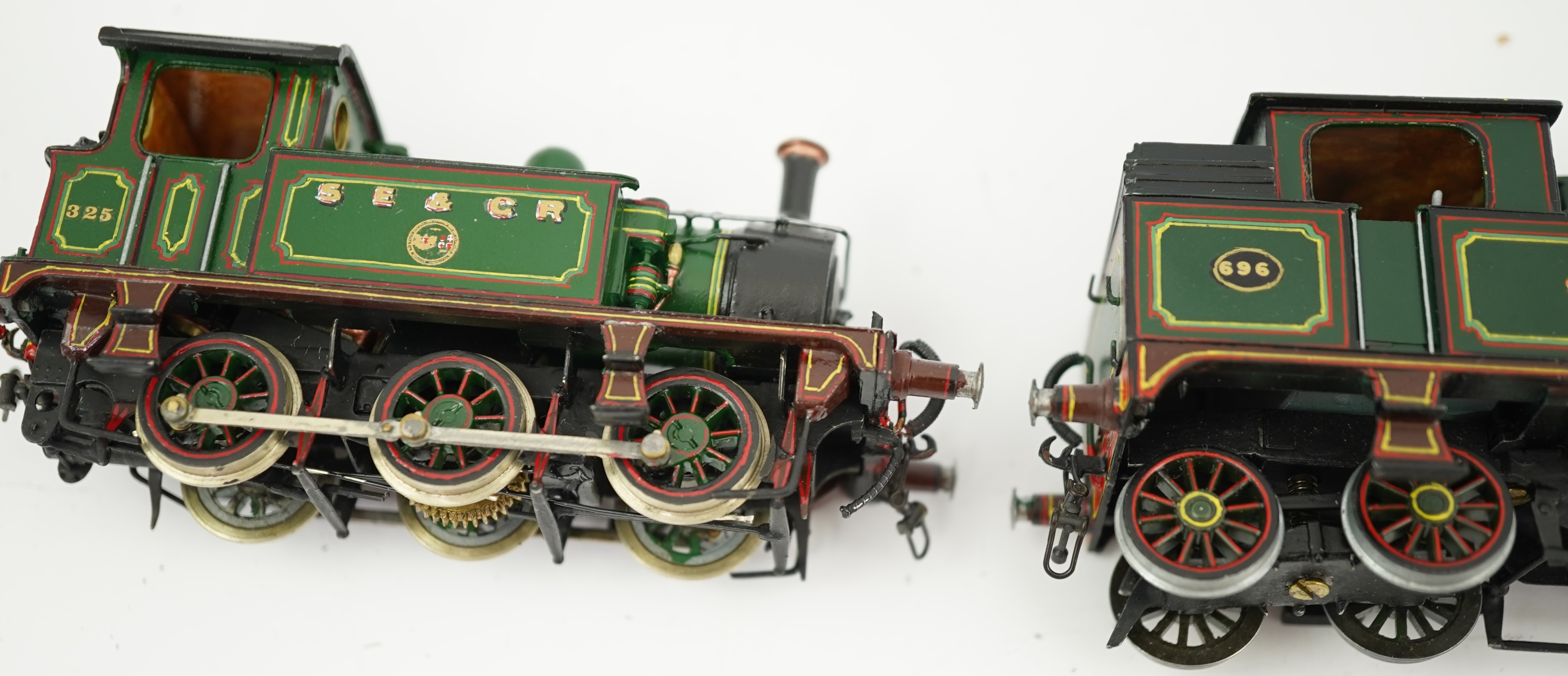 Three 00 gauge brass and white metal kit built Wainwright designed SE&CR tank locomotives (possibly by Wills Finecast); a class R1 0-4-4T, 696, a class H 0-4-4T, 263, and a class P 0-6-0T, 325, constructed, all painted a